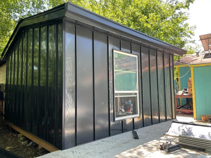 Black standing seam metal wall panels for Roof Inspection in Windcrest