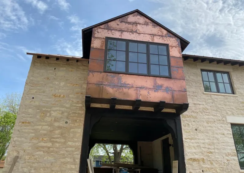 Copper metal panel facade on a stone building for Metal Roof Coating in Windcrest