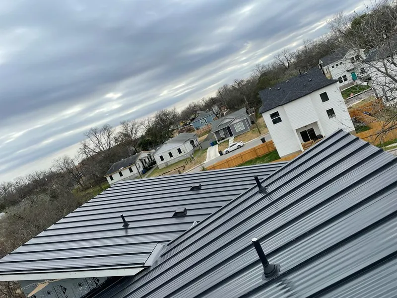 Standing seam metal roof panels with vents for Skylight Repair in Windcrest